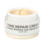 Tone Repair Cream jar with open lid and pale cream inside
