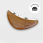 Wood and steel body exfoliator tool with curved half-moon handle and silver edge