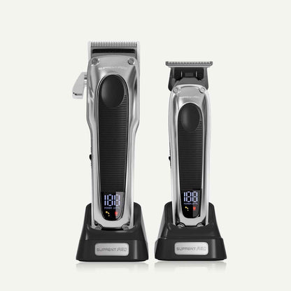 Professional hair clipper set: two silver clippers with black grips and LED display on bases
