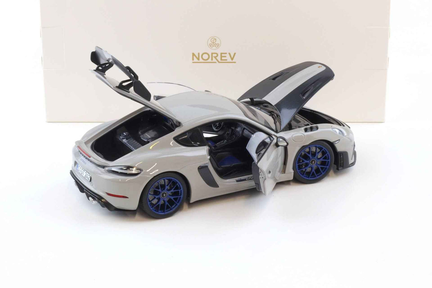 Norev 2023 Porsche 718 Cayman GT4 RS w/ Weissach Package Chalk w/ Blue Wheels 1:18