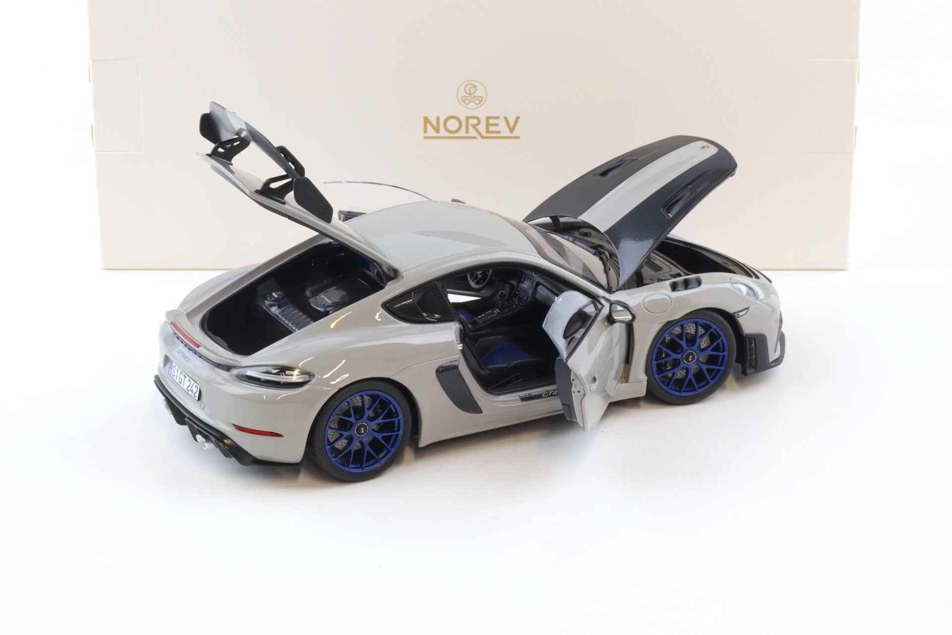 Norev 2023 Porsche 718 Cayman GT4 RS w/ Weissach Package Chalk w/ Blue Wheels 1:18