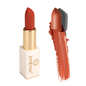 Matte lipstick in gold tube with warm orange-red shade, shown next to a heavy lip swatch.