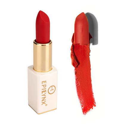 Matte lipstick with red-orange shade in gold tube and white case, with swatch on the side.