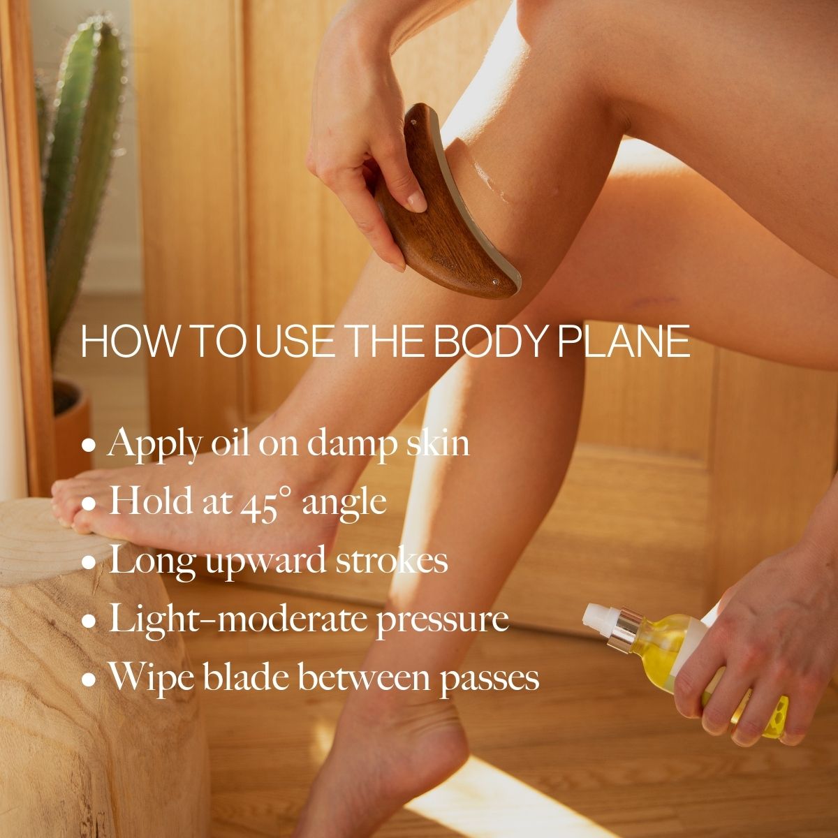 Wood body exfoliator tool in hand used on leg during shower exfoliation