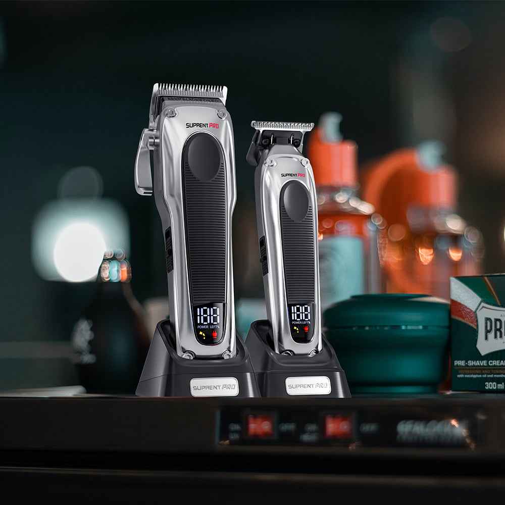 Professional hair clipper set on bases, silver bodies with black grips and LED display