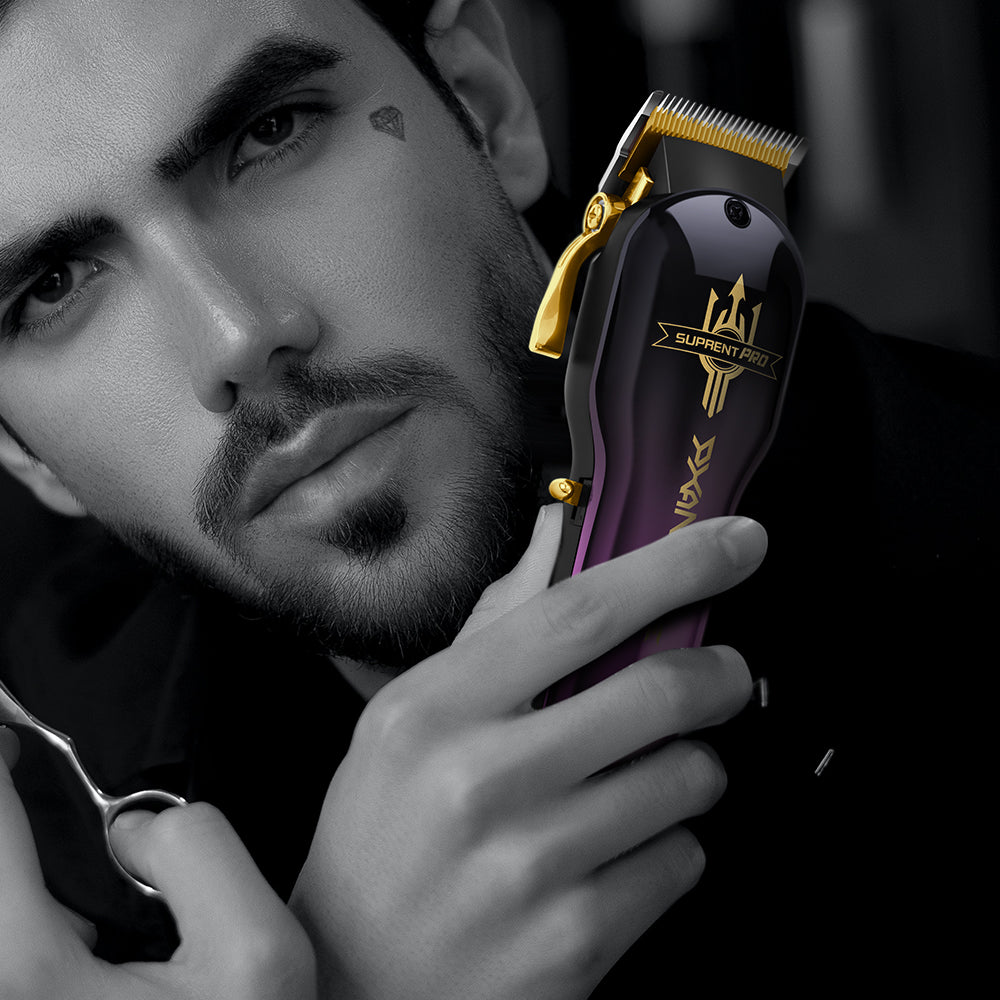 Purple and black hair clipper held near a man’s face, side view