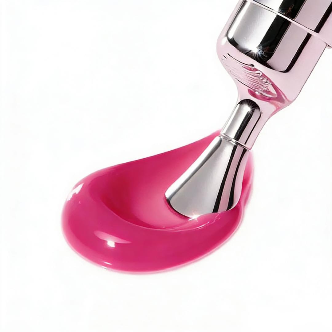 Magenta pink glossy lip treatment flow on applicator tip, with metallic dispenser.