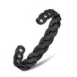 Black magnetic therapy bracelet bangle with twisted links and circular magnetic insets