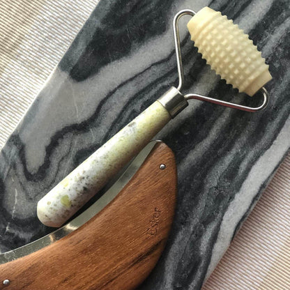 Allover roller with textured light-green head and speckled jade-look handle