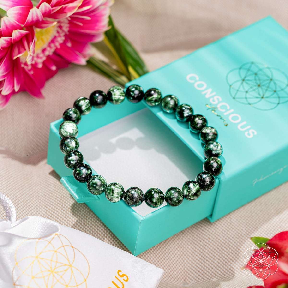 Green seraphinite bead bracelet on turquoise box, round dark green beads