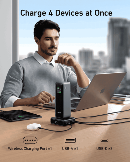 Anker 100W charging base on desk, compact black dock with front LED and USB-C ports