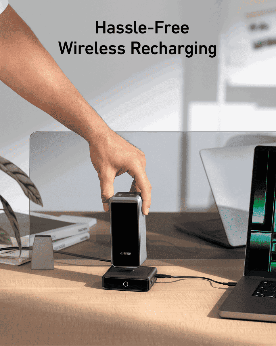 Anker 100W charging base with power bank docked, front LED ring and side connectors