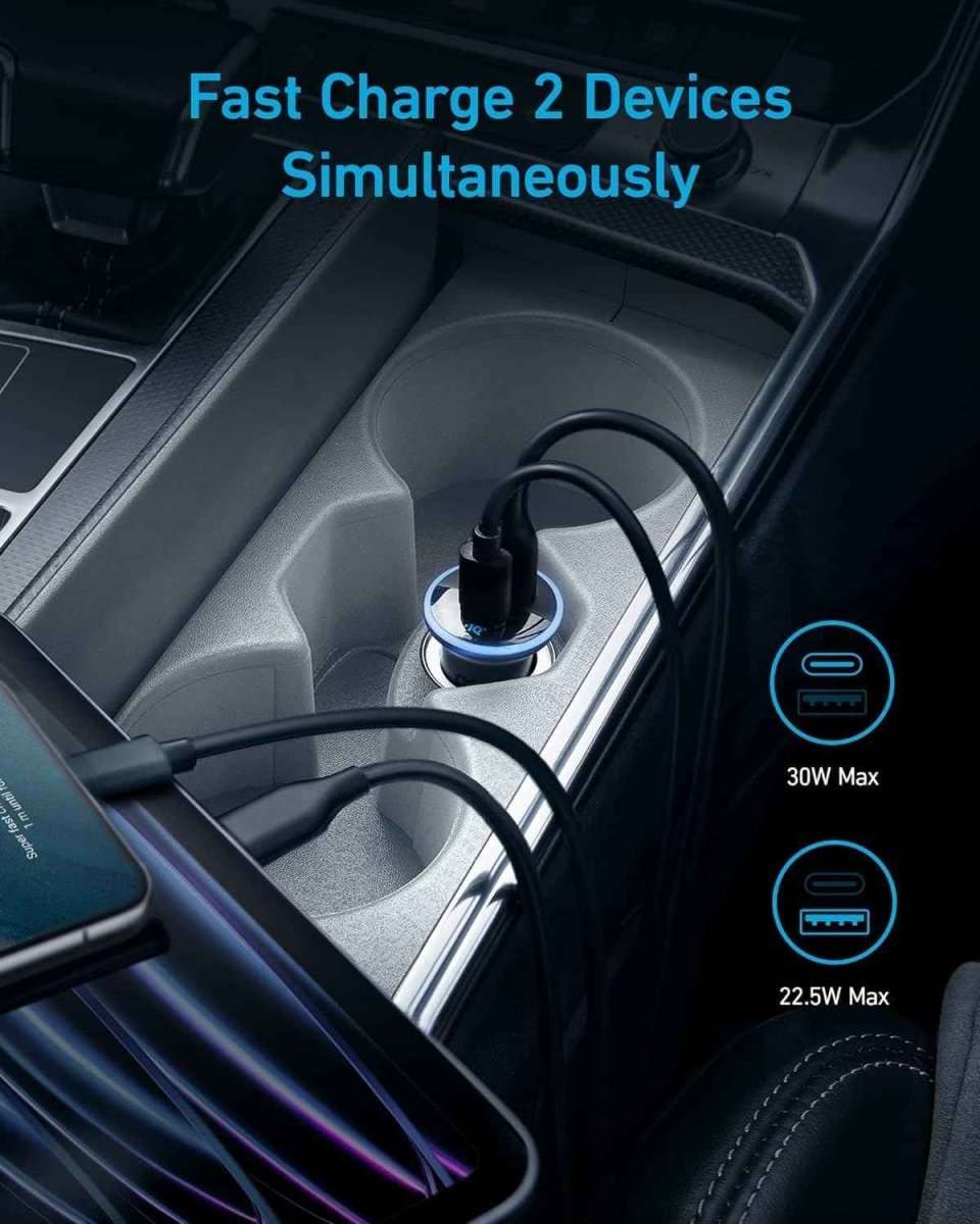 Anker dual-USB car charger with two connected cables in a car console