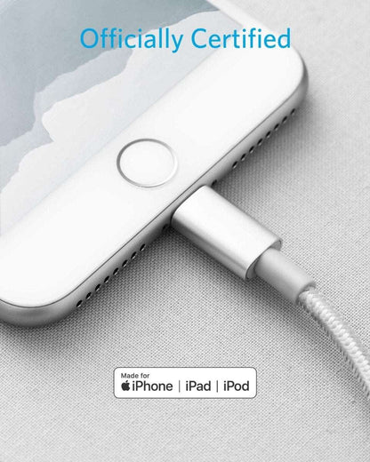 USB-C to Lightning cable with Lightning plug and small loop on a light fabric surface