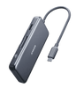 Black USB-C hub with attached USB-C cable, compact 7-port design
