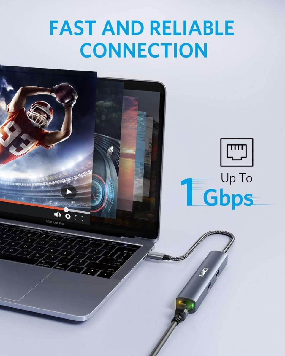 Grey slim USB-C hub with braided cable attached near a laptop USB-C port