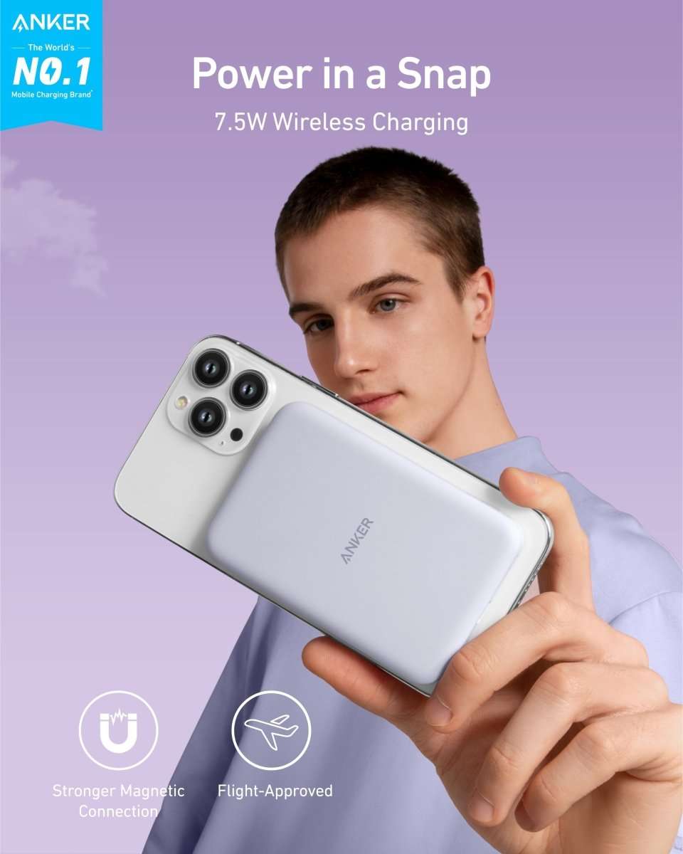 Anker 621 magnetic battery, white slim pack held near a smartphone for charging.