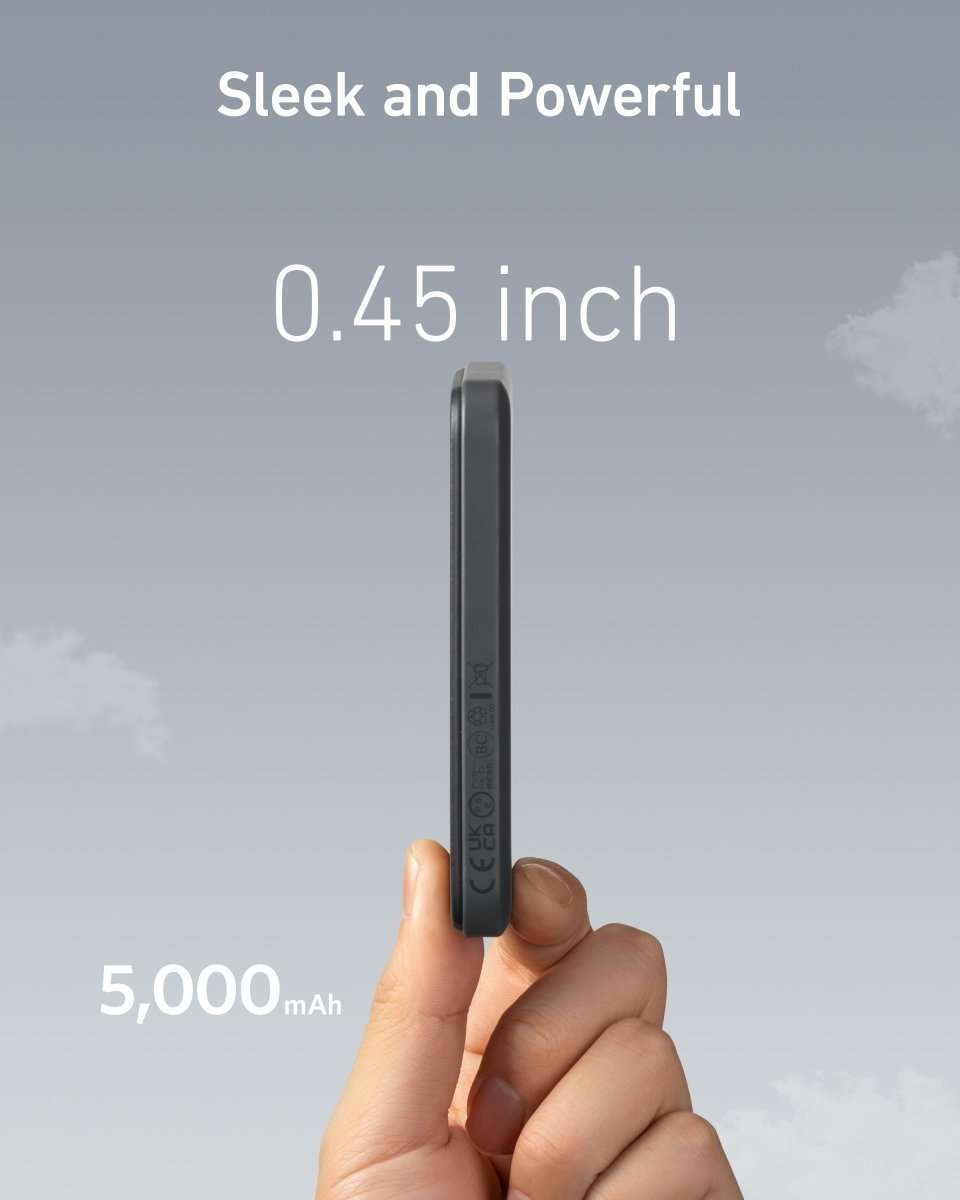 Thin magnetic battery charger, dark gray, shown in hand with slim profile