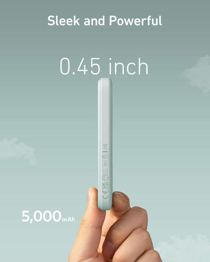 Anker 621 magnetic battery, slim light gray power bank held in hand, side view