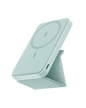 White magnetic battery dock on a foldable stand, showing wireless charging pad and side port