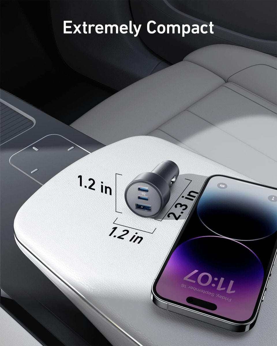 Compact car USB charger with two ports, next to a smartphone on a seat