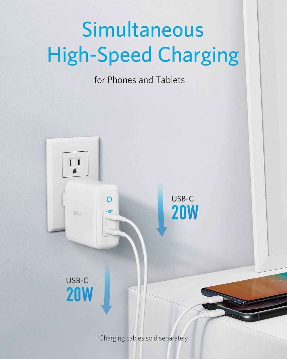 Anker 40W wall charger, white, plugged into wall with two USB-C 20W ports
