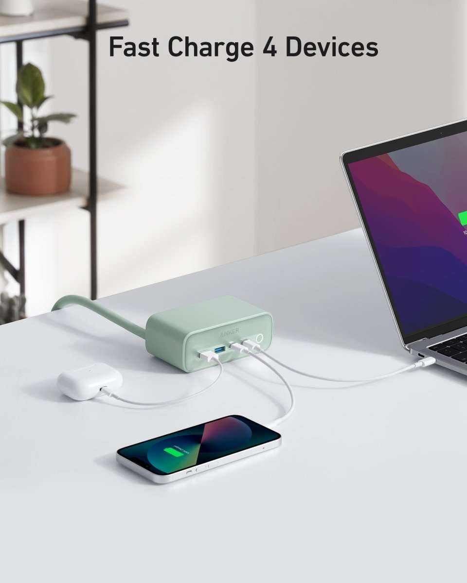 Anker charging station, mint green charging dock with USB ports and connected smartphone