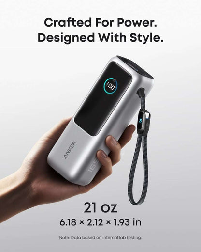Anker laptop power bank in space black with LED display and attached cable