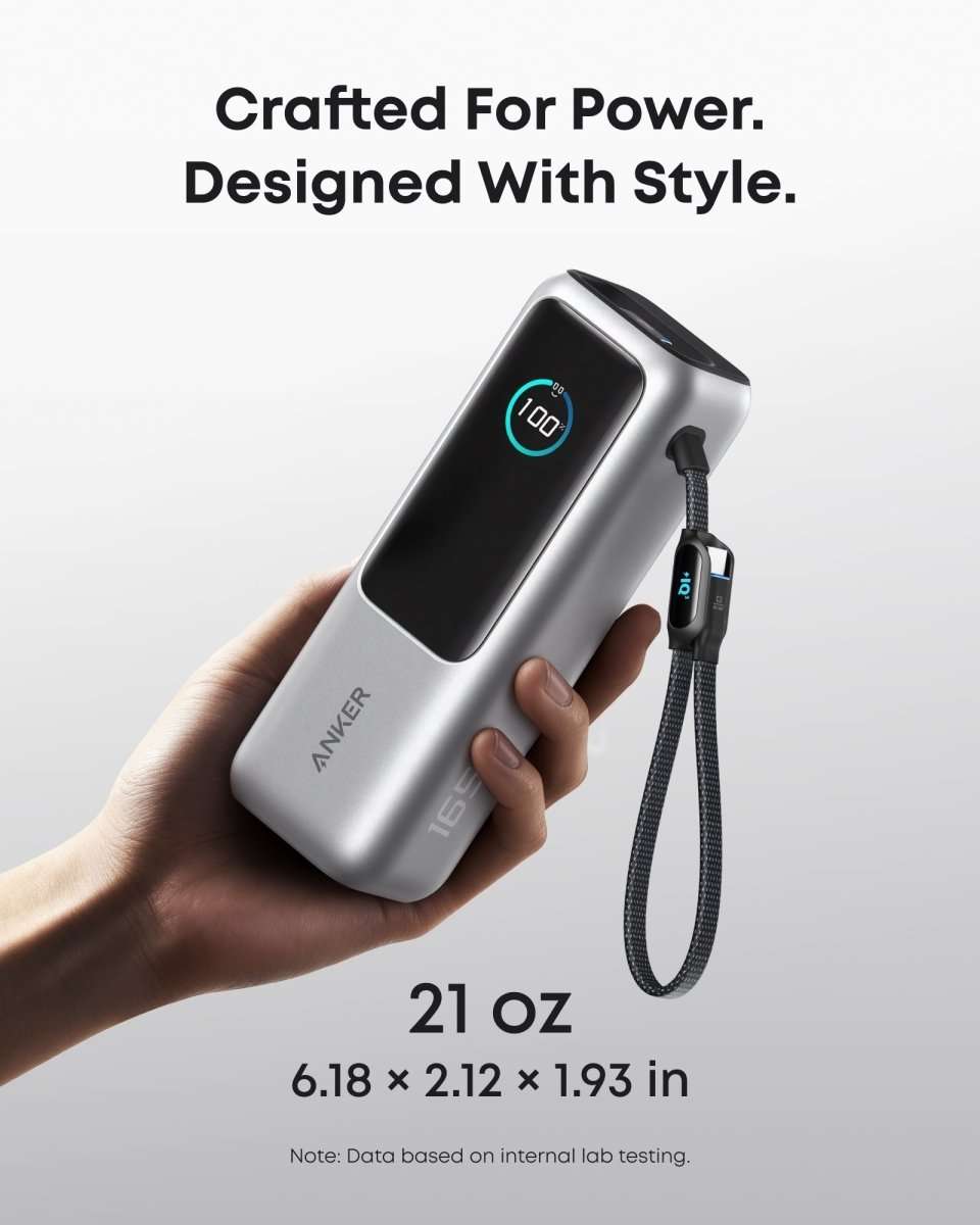Anker laptop power bank held in hand with retractable cable and USB-C port