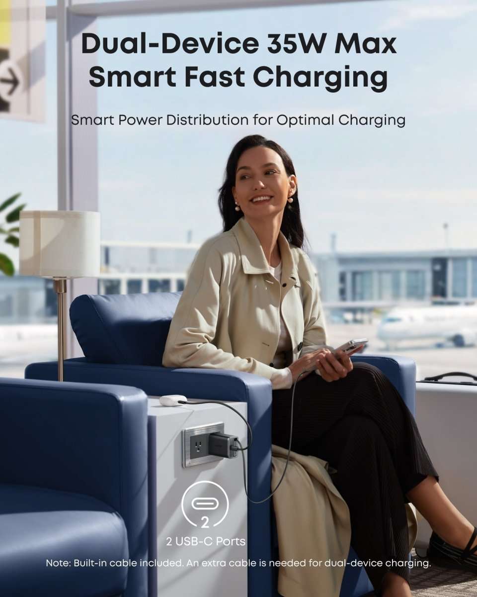 Black dual USB-C fast charger mounted on wall outlet with built-in cable visible