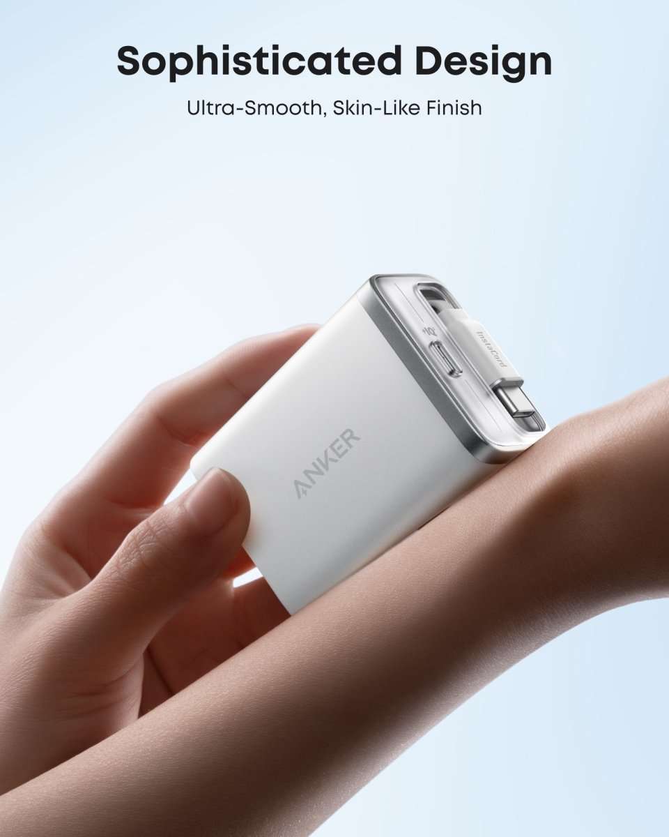 White USB-C wall charger close-up with built-in retractable cable