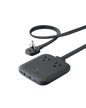 Black compact charging station with two AC outlets and USB ports, connected by cables