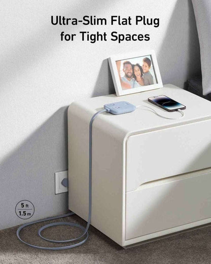 White compact charging station with slim wall plug and built-in power outlets