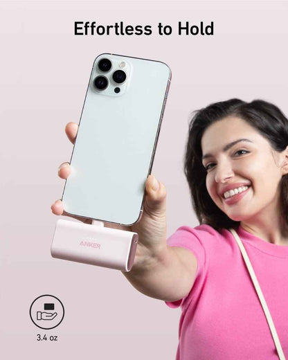Slim power bank with built-in Lightning connector, rose gold finish.