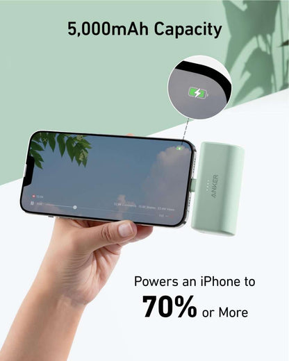 Portable power bank with built-in Lightning connector, mint green finish.