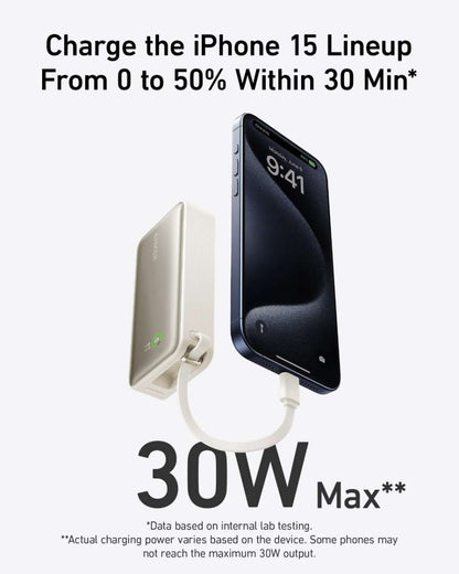 Light color nano power bank charging a smartphone from a wall outlet