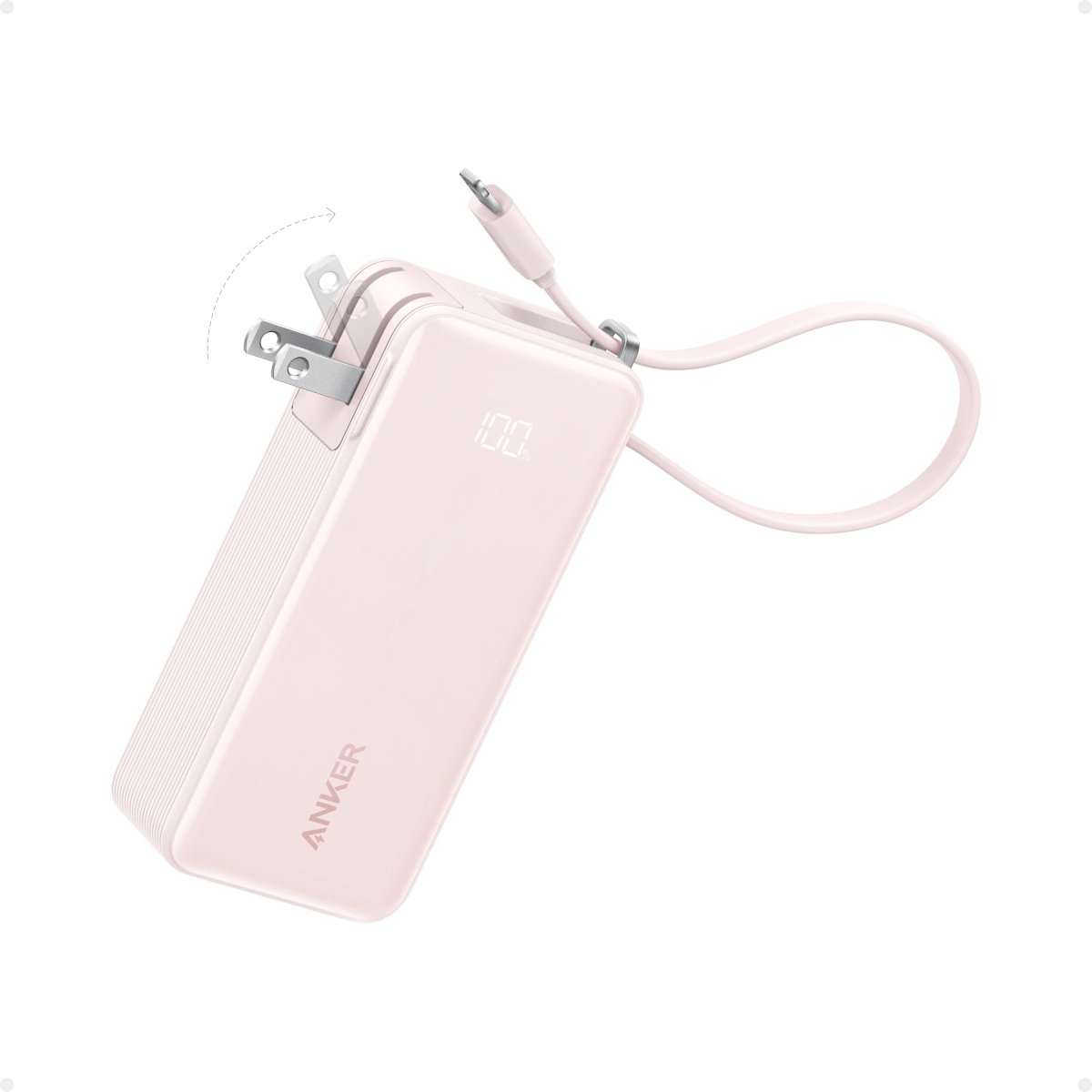Light pink Anker power bank with built-in cable and charging port, digital display on
