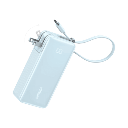 Light blue power bank with built-in USB-C cable connected to a power plug