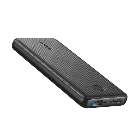 Dark gray power bank side view with USB ports and textured top panel