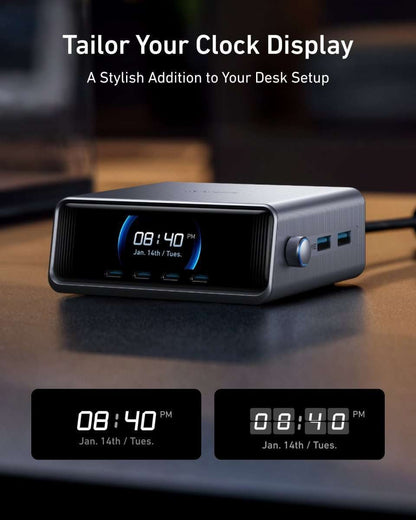 Silver GaN charger on desk with LCD screen showing time and side USB ports