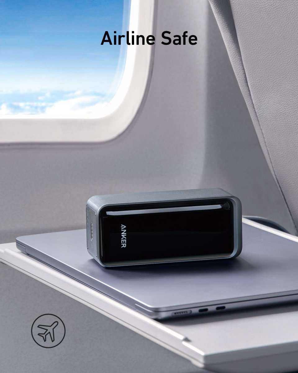 Anker Prime power bank in dark body on laptop tray with side ports