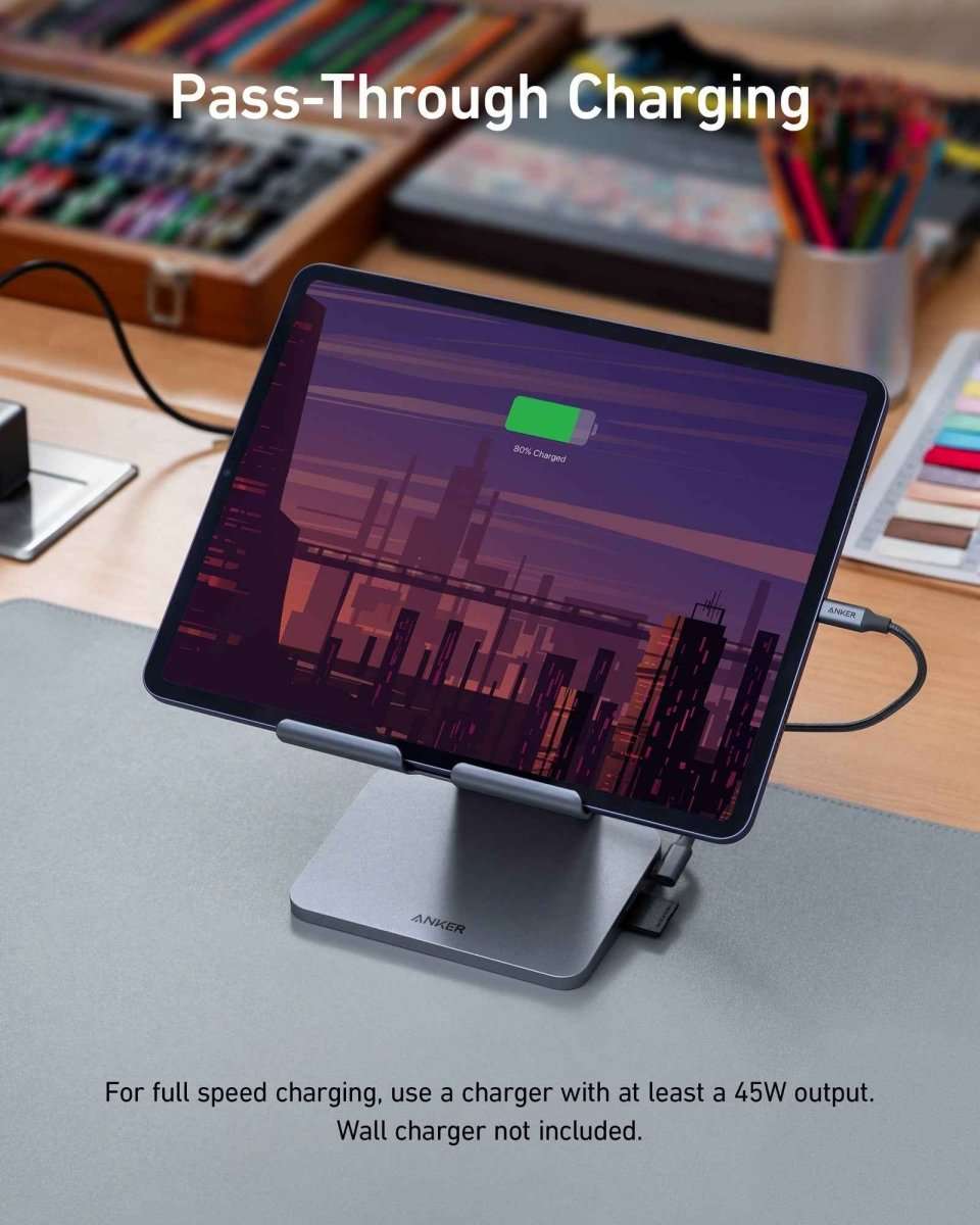 Gray Anker USB‑C tablet stand hub on desk with side charging and data ports