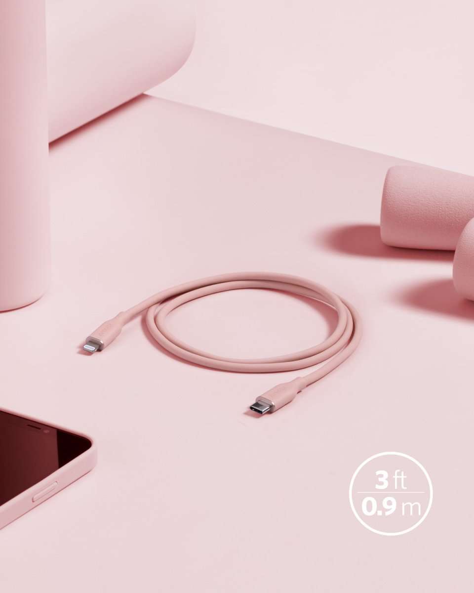 Coral pink USB-C to Lightning cable with coiled 3 ft cord