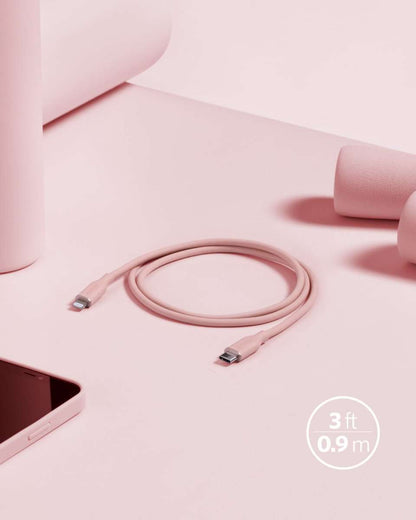 Coral pink USB-C to Lightning cable with coiled 3 ft cord