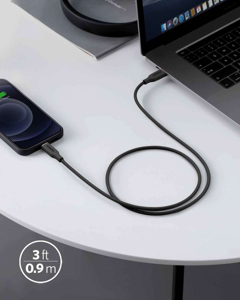Black USB-C to Lightning cable, 3 ft length, connected near a laptop.