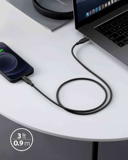 Black USB-C to Lightning cable, 3 ft length, connected near a laptop.
