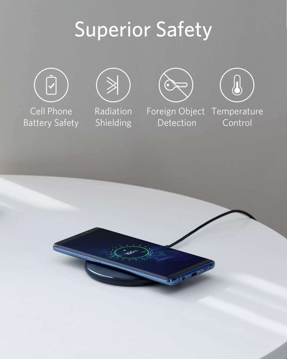 Wireless charging pad with glowing charging ring light under a phone
