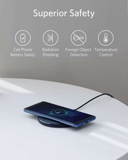 Wireless charging pad with glowing charging ring light under a phone