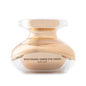Gold and clear under-eye cream jar with beige base and open flip-top lid