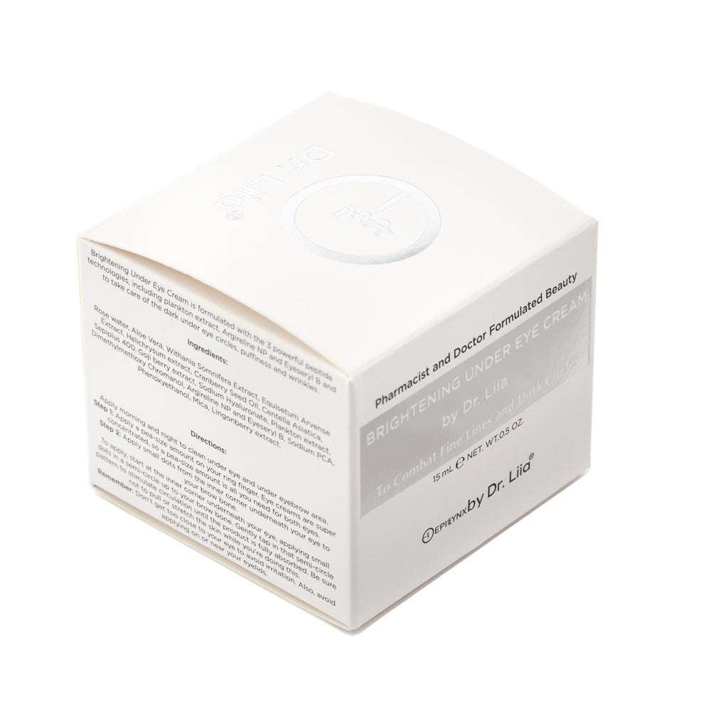 White under-eye cream product box with gold and black printed panel
